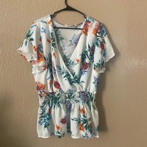 A white blouse with beautiful colored flowers!